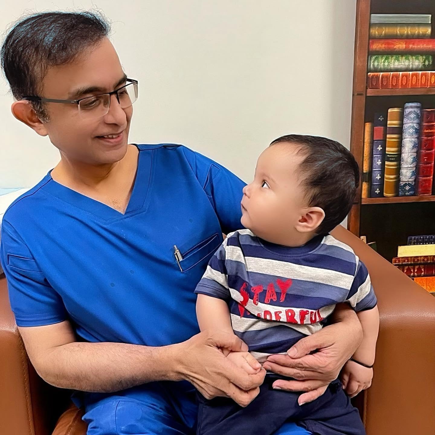 Dr. Farhan Ansari with little boy patient