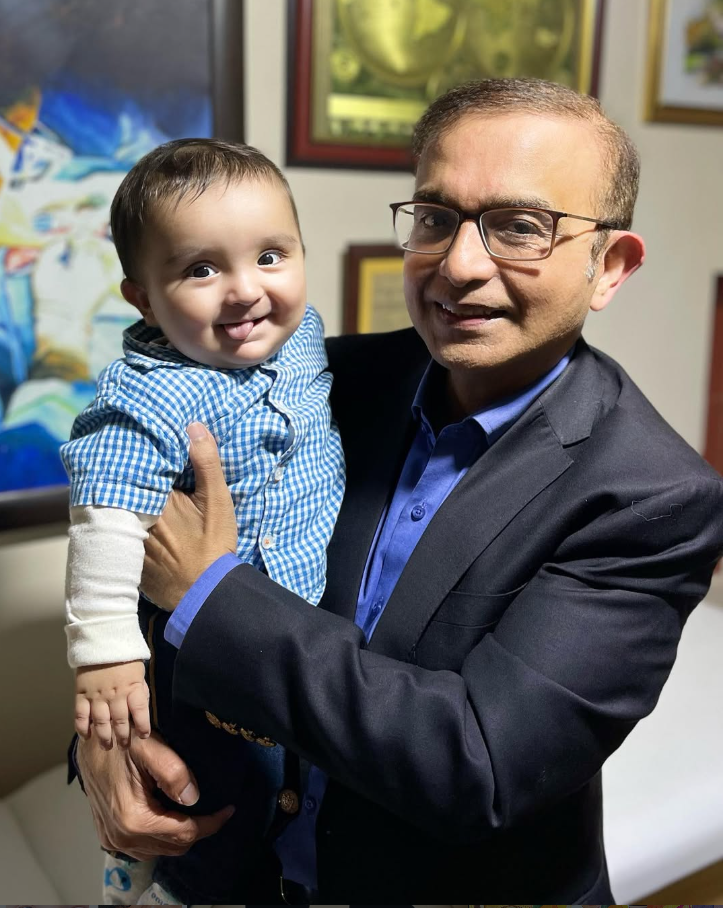 Dr. Farhan Ansari holding cute boy patient